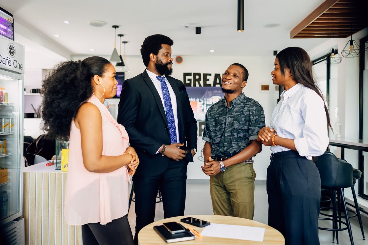 Colleagues standing in a short meeting